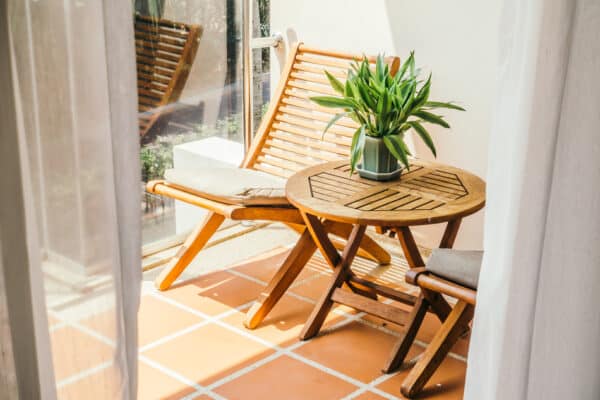 Charming terrace with chair and table in the sun